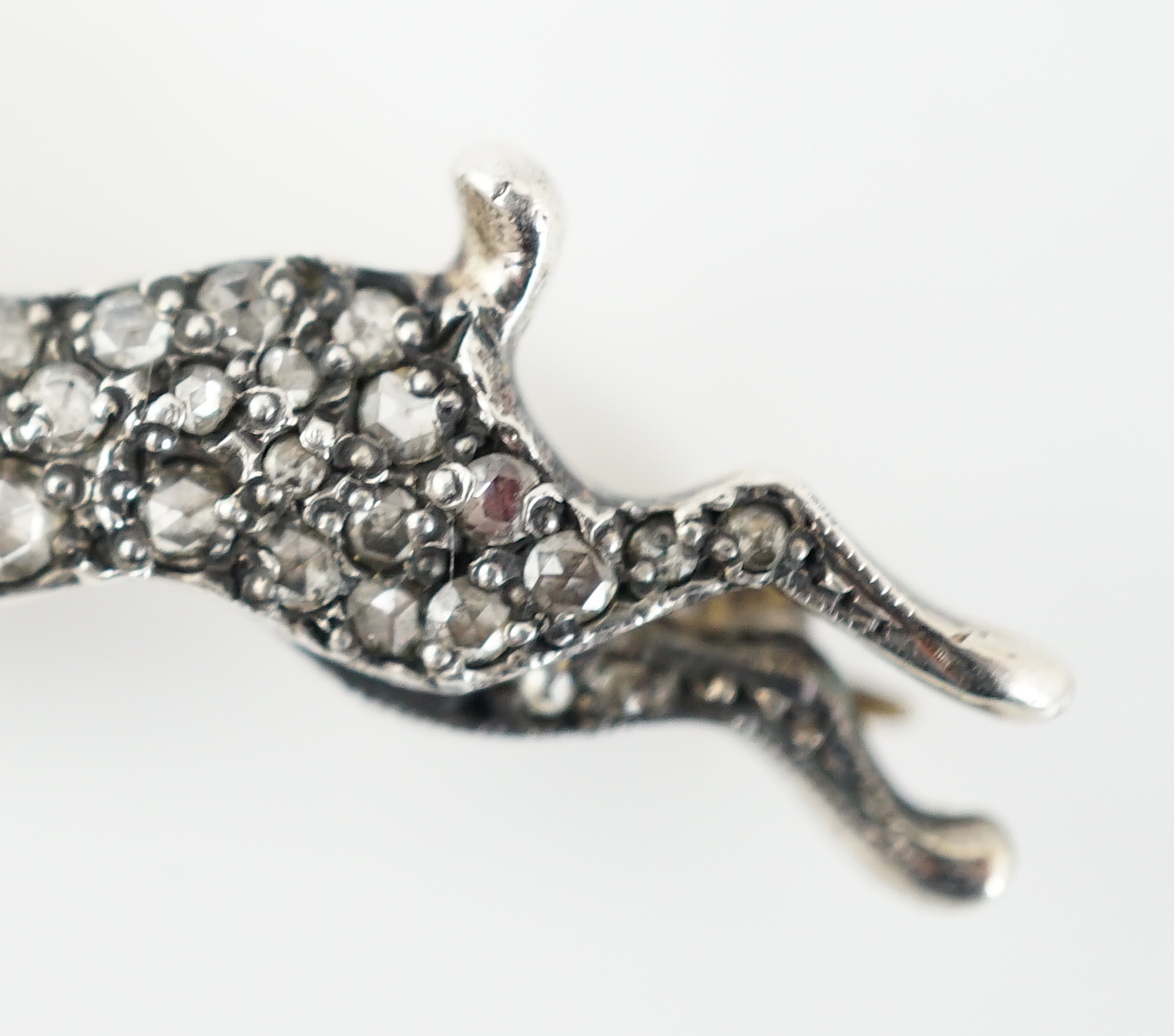 An Edwardian gold, silver and rose cut diamond cluster set hare brooch